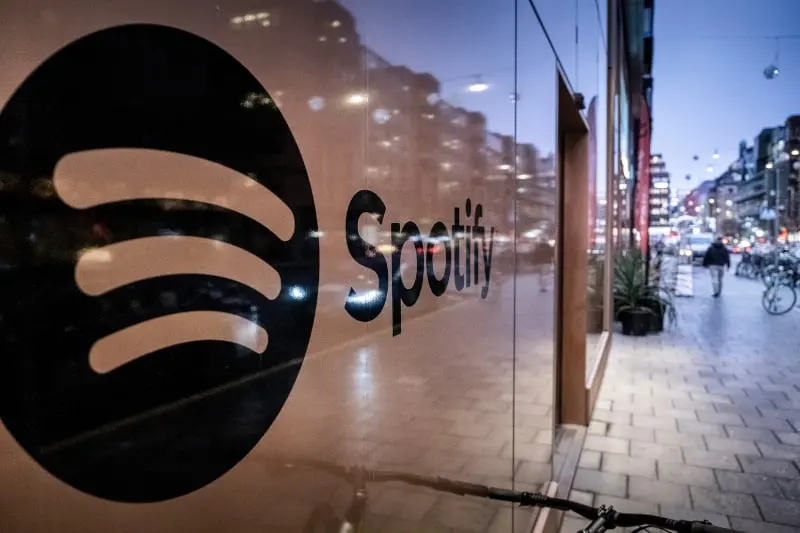 A photo of the Spotify logo on the wall near the entrance to the office.